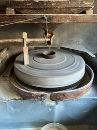 Anchor & Rye gift card: a stone mill used for grinding grain