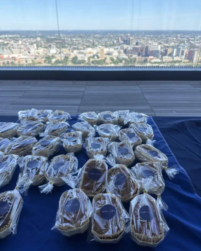 Anchor & Rye loaves wrapped for an event, with the Boston skyline behind